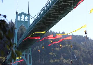 protesters hang from the St. Johns Bridge in Portland, Oregon