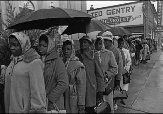 African American citizens wait in the rain to register to vote in Selma, Alabama, on February 17, 1965 (AP Photo)