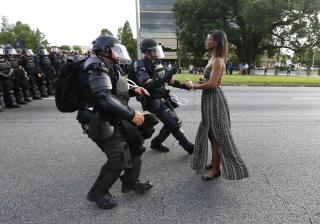 Baton Rouge police approach protester Ieshia Evans during a protest of the fatal police shooting of Alton Sterling