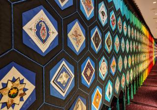 Photo of the Quilt of Belonging, taken at the 2018 Parliament of the World's Religions in Toronto Ontario.