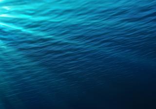 Underwater - blue shining in deep of the sea - Stock image