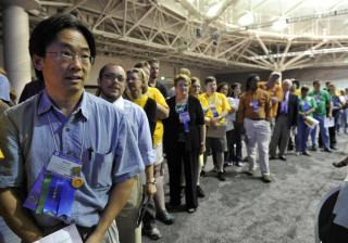 Dr. Jimmy Leung, a delegate from UU Congregation of Phoenix, Arizona, and a long line of other delegates waited to speak at GA 2012