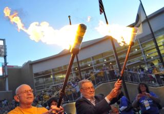 UUA moderator Jim Key and UUA president Peter Morales lead the way to the Saturday evening WaterFire event.