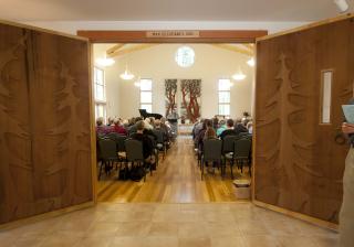 Doors carved by John Long open to the UU Congregation of Whidbey Island sanctuary.