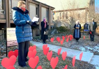The Rev. Florence Caplow outside the UU Church of Urbana-Champaign, Illinois, which in January opened a memorial on its front lawn