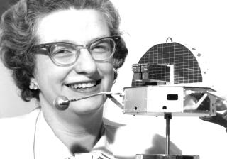 NASA astronomer Nancy Grace Roman with a satellite model in 1961