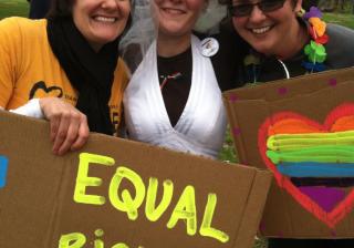 Jamie Crispin, Kimberly Daughtery, and Sara O'Keeffe celebrate after the Million 'Fag' March  held in May in Topeka.