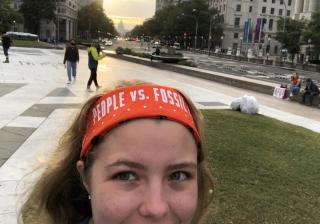 Selfie of Zoë Johnston in Washington, D.C., with the Capitol building in the background, October 15, 2021, to join in protest and arrest to demand climate action.