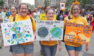 Three UU protestors at the People's Climate March in New York City in September 2014.