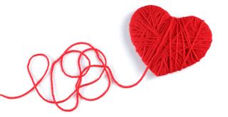 stock image of a heart shape wrapped in red yarn. the end of the yarn is loose and tangled. 