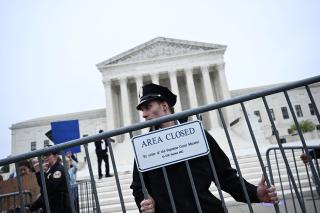 Police place a barricade in front of US Supreme Court. People protesting reversing of abortion rights