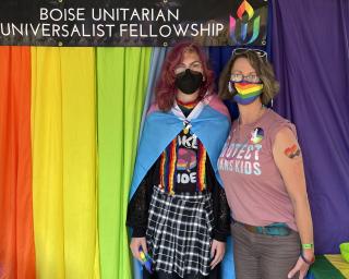 Rev. Sara LaWall and her daughter June pose in their congregation's Pride tent
