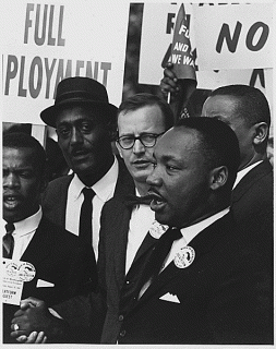 Rev. Dr. Martin Luther Luther King, Jr., and other Civil Rights movement allies at a demonstration.