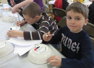 Children from First Parish in Norwell makes bowls