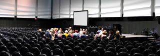 A small breakout group meeting in a large auditorium at 2018 General Assembly
