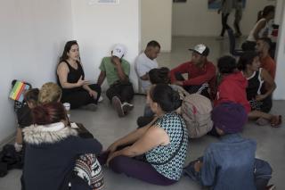 A US volunteer lawyer informs migrants on what to expect when requesting asylum in the US, at an office in Tijuana, Mexico, Friday, April 27, 2018. 