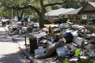 Flood damaged debris from homes lines the street in the aftermath of Hurricane Harvey on Thursday, September 7, 2017, in Houston