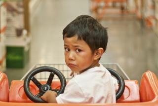 child in shopping cart