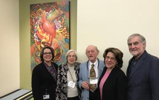 Dedication of a painting by Daniel Nevins to Brad and Julia Bradburd in the front lobby of the UUA in 2017.