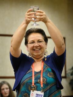 The Rev.  Dr. María Cristina Vlassidis Burgoa honors the Ancestors and blesses the space before the workshop “Indigenous Experience and Unitarian Universalism” at GA 2019.