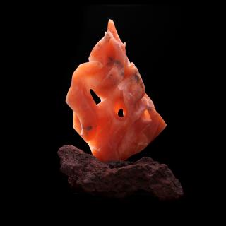 Sculpture: creations Fire. © 2012 Dale Niemann. Translucent orange alabaster and red lava stone. 22 x 14 x 12 inches.