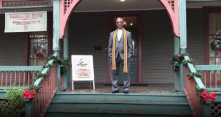 The Rev. Duncan Teague on the porch of the Hammonds House Museum, which Abundant LUUv calls home.