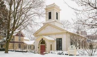 Outside of a curch on a snowy day