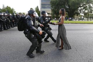 Baton Rouge police approach protester Ieshia Evans during a protest of the fatal police shooting of Alton Sterling