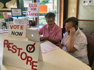 Spouses Linda Wright (left) and the Rev. Robin Gray volunteer at the UU Tallahassee Second Chances Phone Banking event September 22, 2018, in Florida.