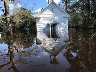 A building at Shelter Neck Unitarian Universalist Camp surrounded by several feet of water, flooded after hurricane Florence