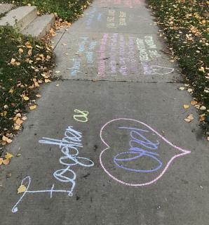 Images of support chalked on neighborhood sidewalks "Neighborhood love notes"