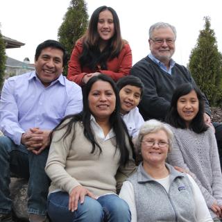 The Rev. Peter Morales (top right) and Phyllis Morales (bottom right) with Juan de Dios García (bottom left) and Maria Osorio Chen (second from left) and their family.