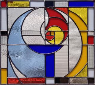 Stained glass window of a flaming chalice using the proportions of the Fibonacci sequence.