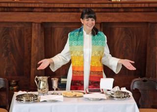 The Rev. Robin Bartlett, who is ordained as both a Unitarian Universalist and United Church of Christ minister, leads communion at First Church in Sterling, Massachusetts, a federated church.