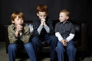 Three brothers practice praying