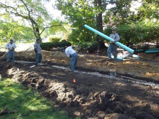 laying pipe for the rain garden