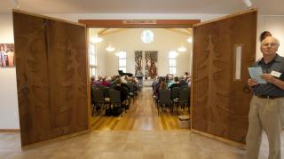 Doors carved by John Long open to the UU Congregation of Whidbey Island sanctuary.