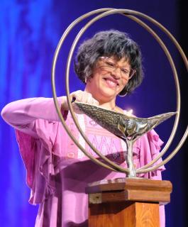 Mariela Pérez-Simons lights the chalice during the opening celebration of the 2019 UUA General Assembly in Spokane, Washington, on Wednesday, June 19, 2019