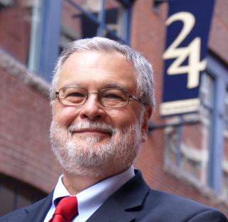   UUA President Peter Morales stands outside 24 Farnsworth Street in Boston.