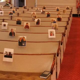 The Rev. Lara Hoke placed photographs of congregants of First Church Unitarian in Littleton, Massachusetts, on the pews where she was accustomed to seeing them after the congregation stopped holding worship services during the covid-19 shutdown.