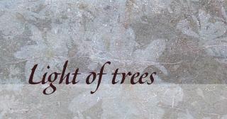 background image of leaves frozen in ice, with a poem title of "Light of trees".