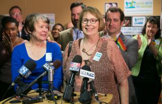 Lisa Chickadonz, left, and Chris Tanner, right, members of First Unitarian Church of Portland, were plaintiffs in the challenge to Oregon's marriage ban