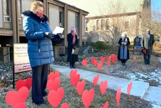 The Rev. Florence Caplow outside the UU Church of Urbana-Champaign, Illinois, which in January opened a memorial on its front lawn