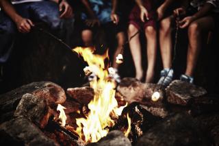 Roasting marshmallows around the campfire