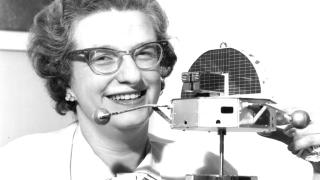 NASA astronomer Nancy Grace Roman with a satellite model in 1961