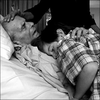 Man in hospice, with child (Damon Brandt)