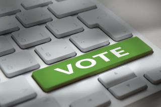 White computer keyboard with "vote" button stock photo