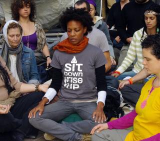 People sitting and meditating at Liberty Park on Sunday, October 16, Day 31 of Occupy Wall Street