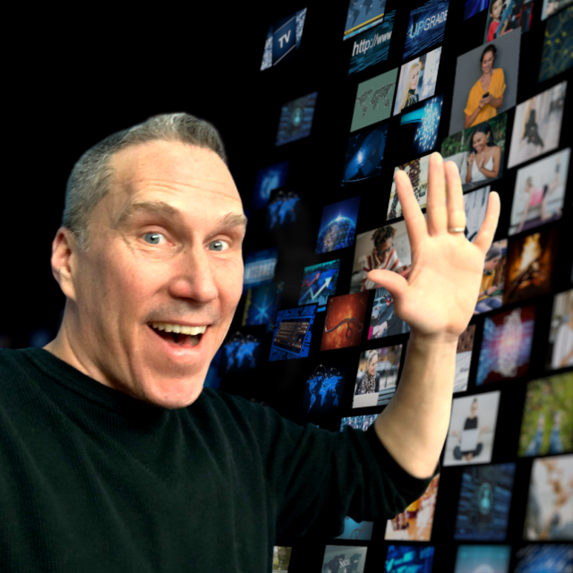 Image of Peter Bowden with various digital screens behind him.